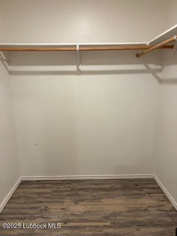 a bedroom with a bed and a mirror