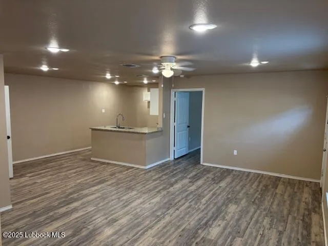 a view of kitchen with stainless steel appliances wooden floor