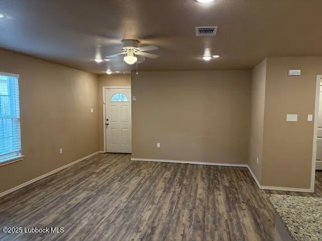 a kitchen with granite countertop a sink stove and refrigerator
