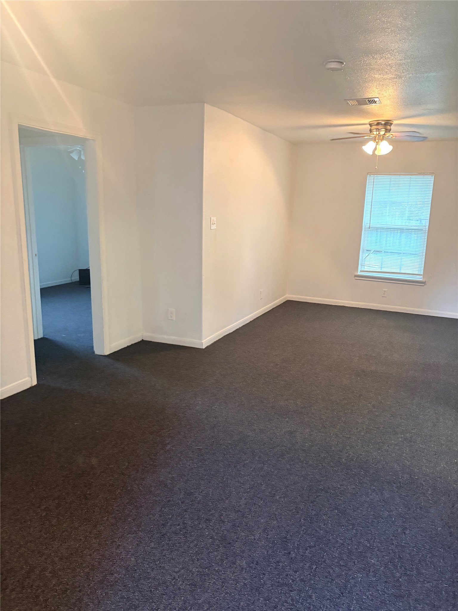 5510 Chennault Road Houston, TX 77033 - Photo 3 of 10 a view of an empty room with a window