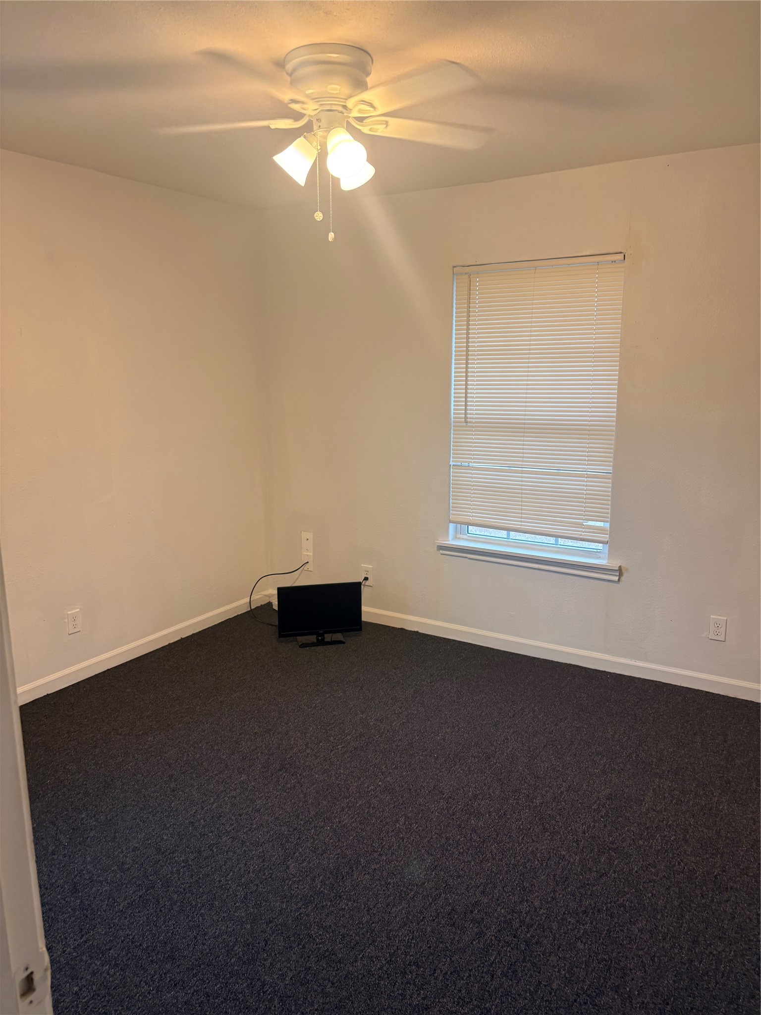5510 Chennault Road Houston, TX 77033 - Photo 8 of 10 a view of an empty room with a window