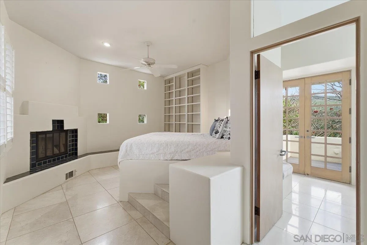 7030 Elfin Oaks Road Escondido, CA 92029 - Photo 12 of 36 a bedroom with a bed and a large window