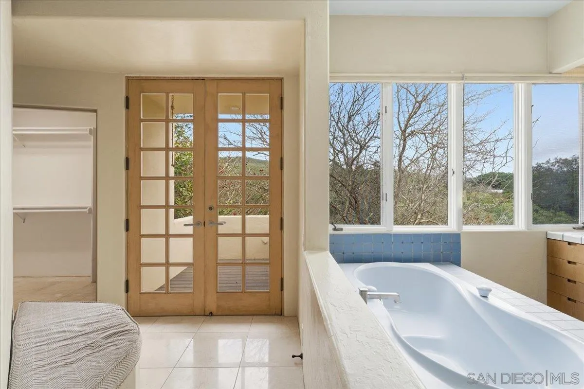7030 Elfin Oaks Road Escondido, CA 92029 - Photo 19 of 36 a spacious bathroom with a bathtub and a shower