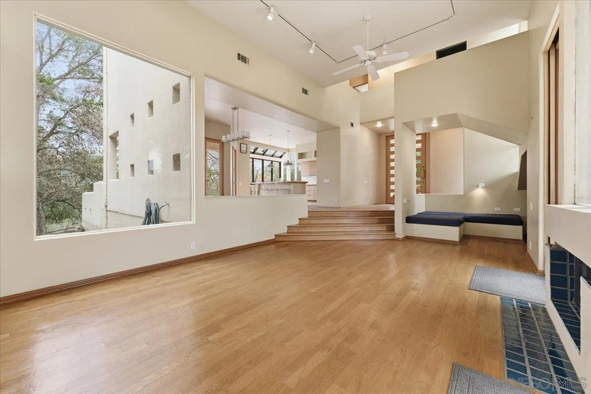 7030 Elfin Oaks Road Escondido, CA 92029 - Photo 2 of 36 a view of an empty room with a fireplace