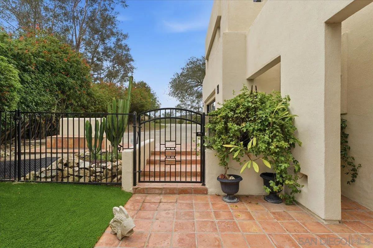 7030 Elfin Oaks Road Escondido, CA 92029 - Photo 21 of 36 a view of a front door and garden
