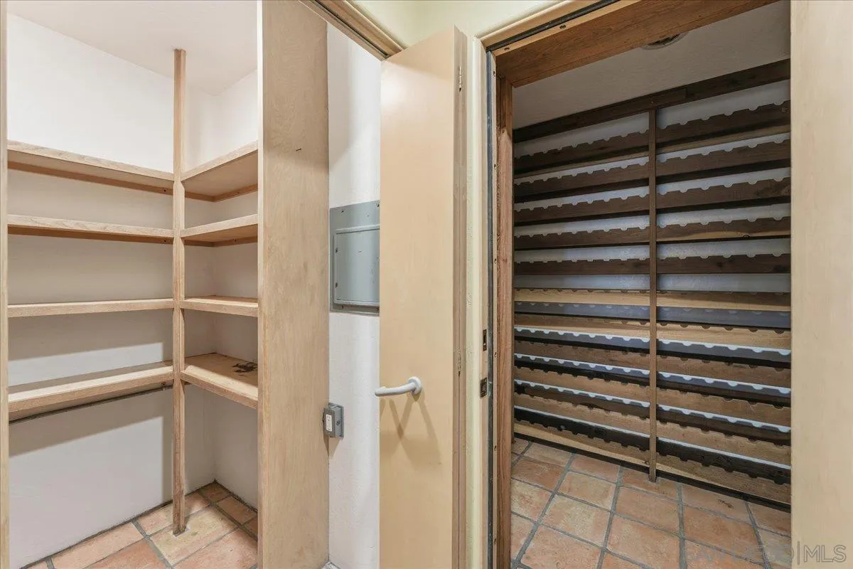 7030 Elfin Oaks Road Escondido, CA 92029 - Photo 28 of 36 a view of walk in closet with empty racks