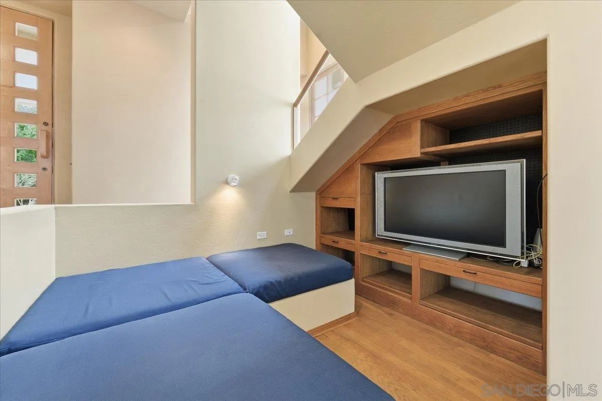 7030 Elfin Oaks Road Escondido, CA 92029 - Photo 31 of 36 a living room with furniture and a flat screen tv