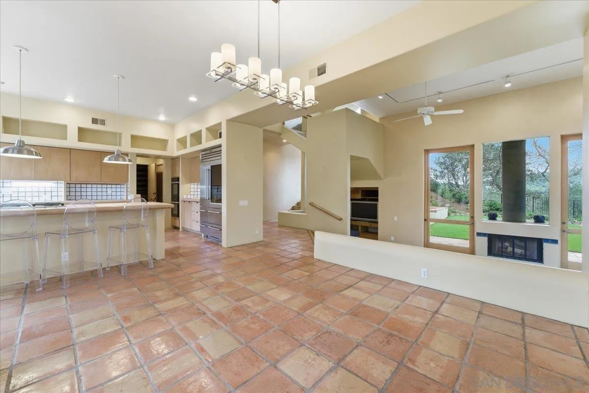 7030 Elfin Oaks Road Escondido, CA 92029 - Photo 6 of 36 a view of a kitchen with a sink and chandelier