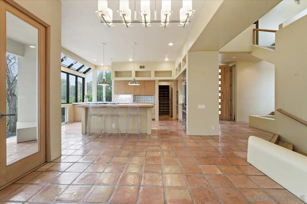7030 Elfin Oaks Road Escondido, CA 92029 - Photo 7 of 36 a view of a big room with windows and chandelier