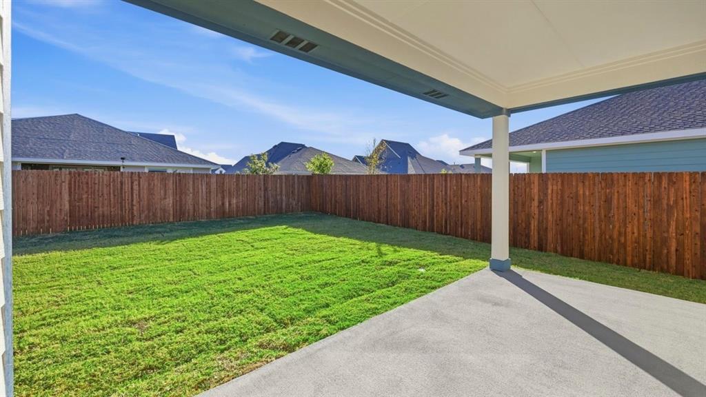 729 Lantana Lane Pilot Point, TX 76258 - Photo 17 of 19 a view of a backyard with a garden