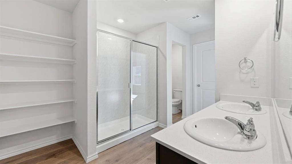 729 Lantana Lane Pilot Point, TX 76258 - Photo 8 of 19 a bathroom with a sink and a mirror