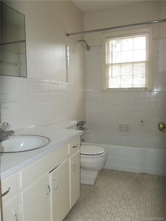 4227 Walker Road, Unit 4 Charlotte, NC 28211 - Photo 4 of 6 a bathroom with a toilet a sink and bathtub