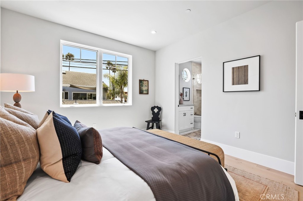 825 West Bay Avenue, Unit B Newport Beach, CA 92661 - Photo 11 of 30 a bedroom with a large bed and a window