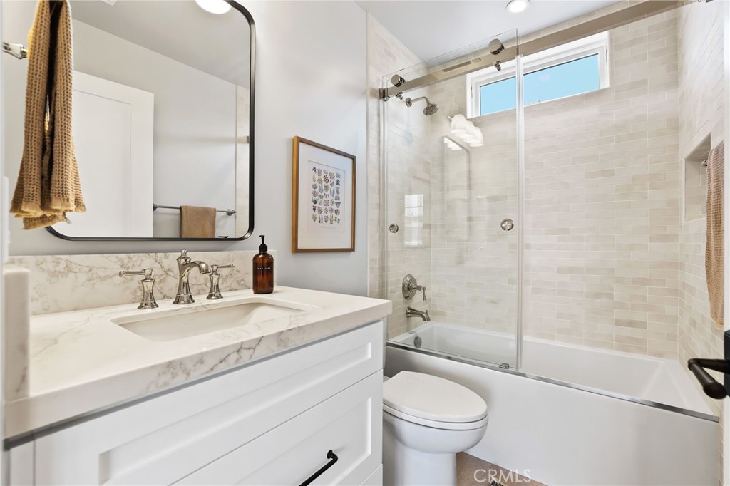 825 West Bay Avenue, Unit B Newport Beach, CA 92661 - Photo 14 of 30 a bathroom with a sink a toilet and shower