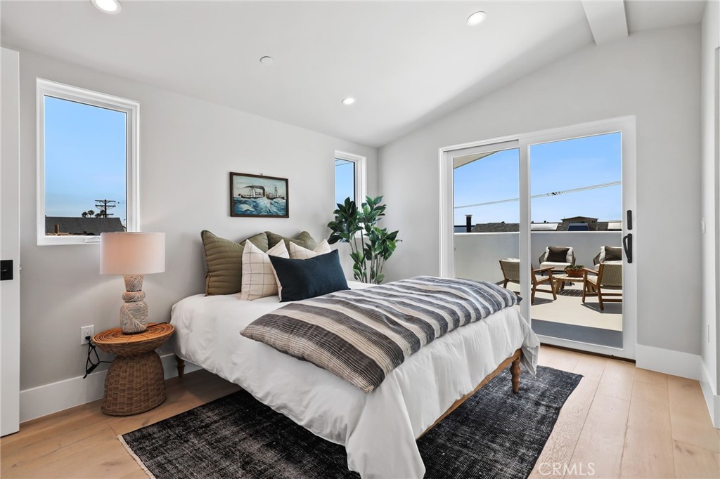 825 West Bay Avenue, Unit B Newport Beach, CA 92661 - Photo 16 of 30 a bedroom with bed and a couch