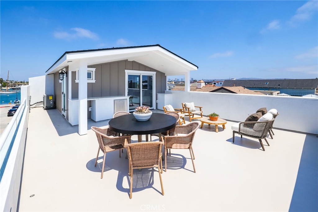 825 West Bay Avenue, Unit B Newport Beach, CA 92661 - Photo 20 of 30 a swimming pool with outdoor seating and city view
