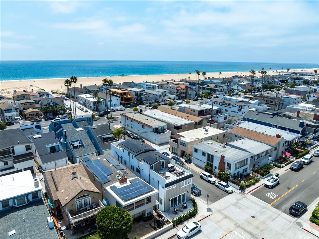 825 West Bay Avenue, Unit B Newport Beach, CA 92661 - Photo 23 of 30 an aerial view of a city with lots of residential buildings and ocean view in back