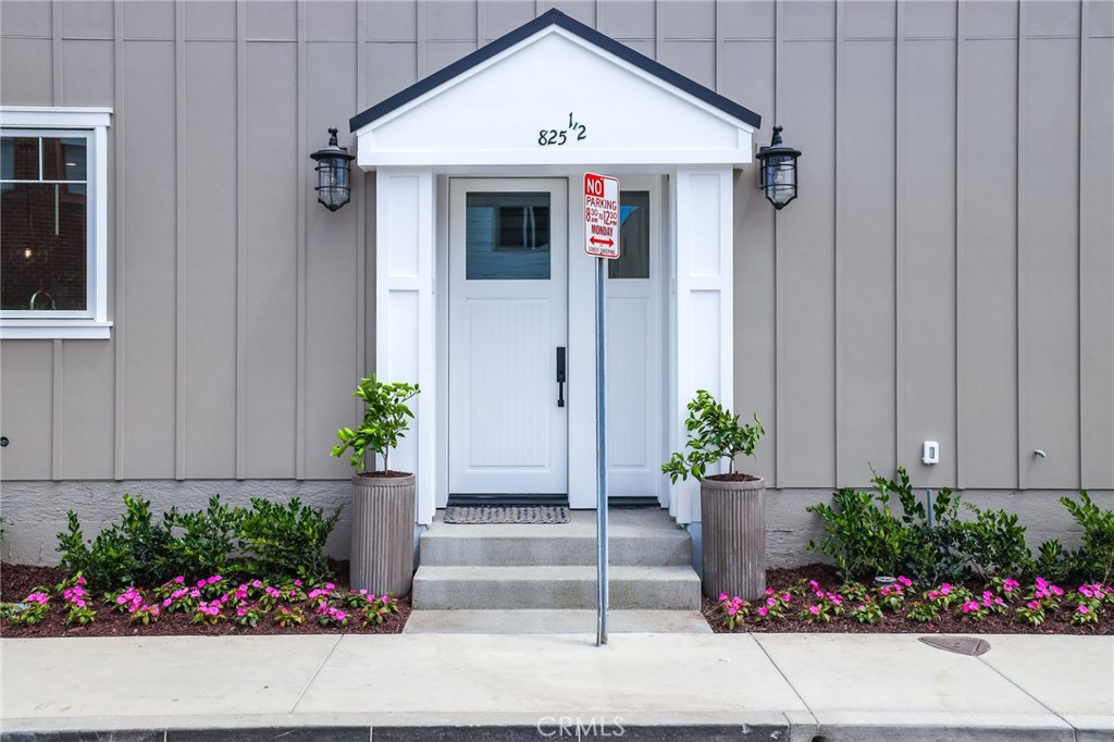 825 West Bay Avenue, Unit B Newport Beach, CA 92661 - Photo 28 of 30 a front view of a house and a garden