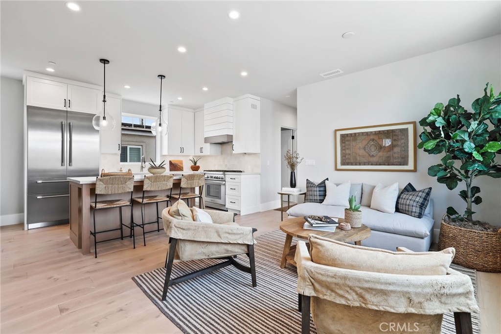 825 West Bay Avenue, Unit B Newport Beach, CA 92661 - Photo 4 of 30 a living room with furniture and kitchen view