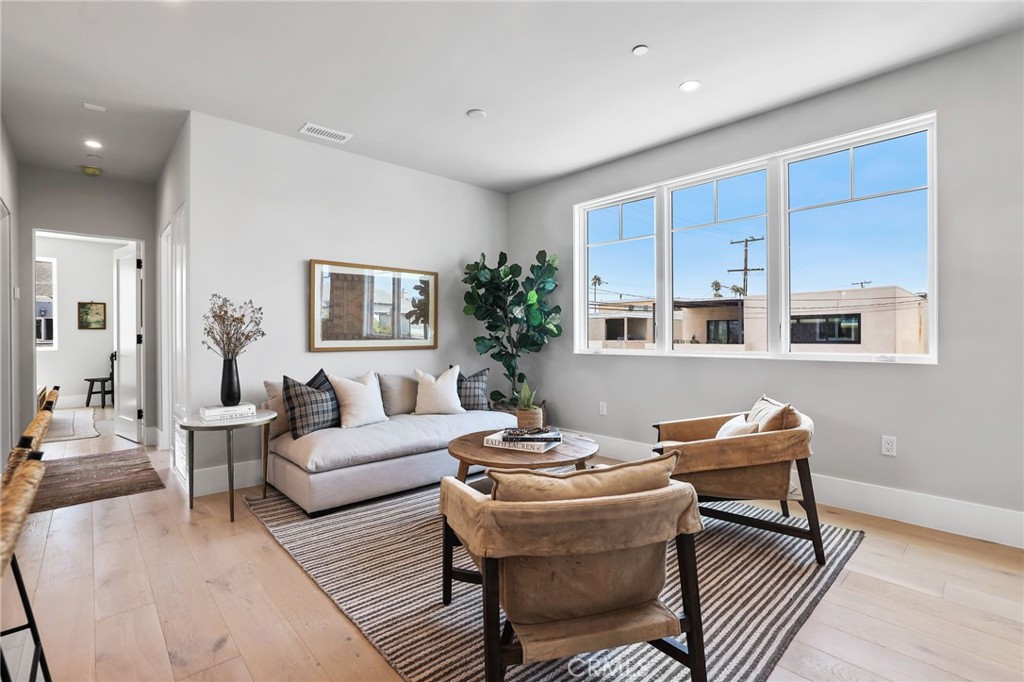 825 West Bay Avenue, Unit B Newport Beach, CA 92661 - Photo 5 of 30 a living room with furniture and a table