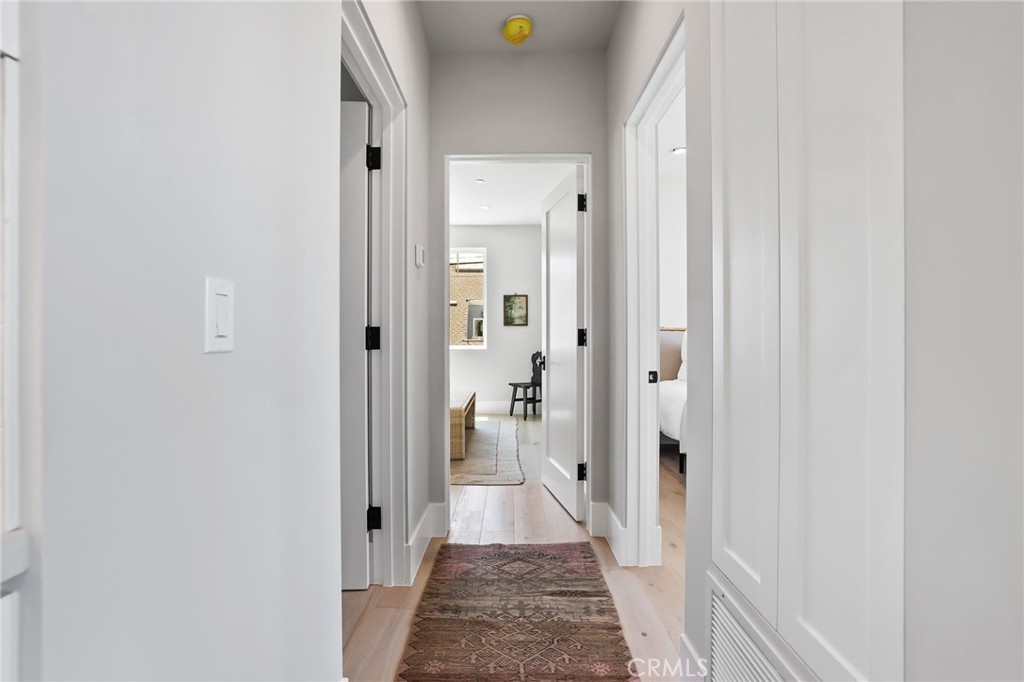 825 West Bay Avenue, Unit B Newport Beach, CA 92661 - Photo 8 of 30 a view of a hallway with a livingroom and a bathroom with a sink