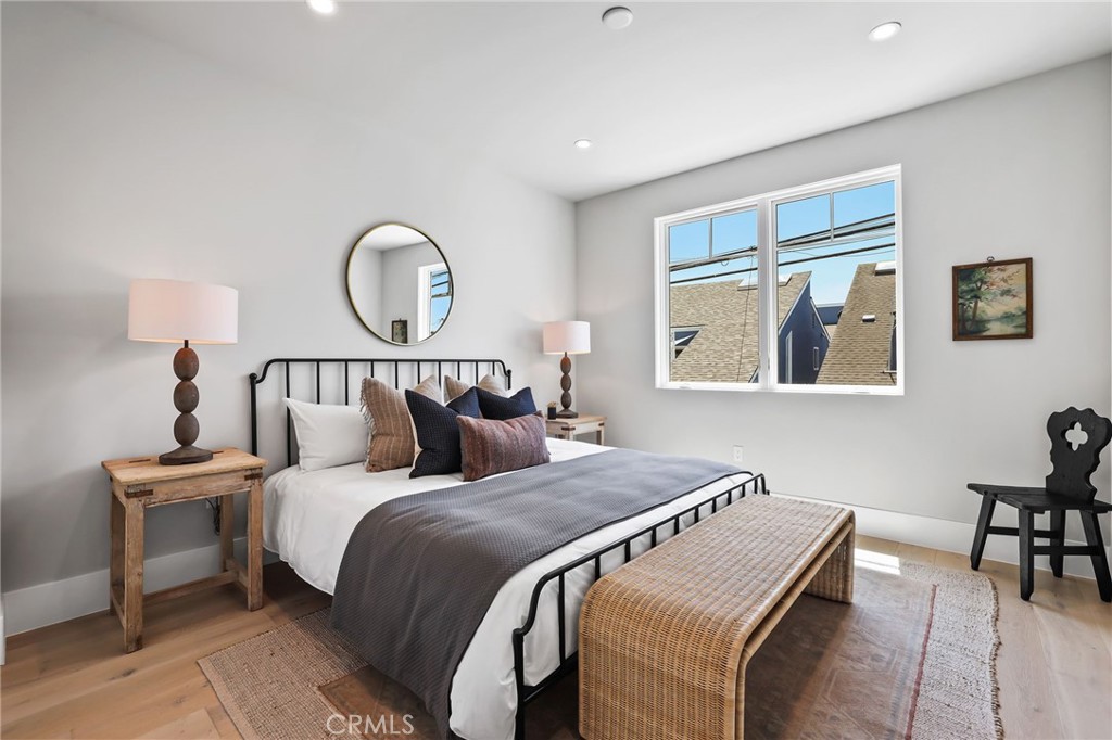 825 West Bay Avenue, Unit B Newport Beach, CA 92661 - Photo 9 of 30 a bedroom with bed and a painting on the wall