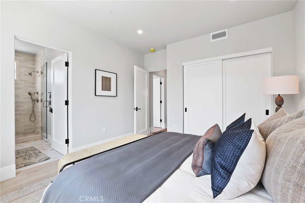 825 West Bay Avenue, Unit B Newport Beach, CA 92661 - Photo 10 of 30 a spacious bedroom with a bed and a shower