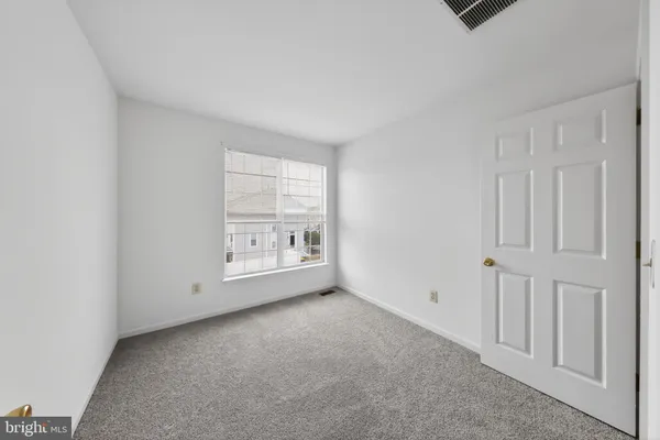 a view of an empty room with stairs
