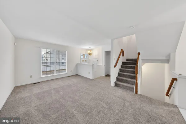 wooden floor in an empty room with a fireplace