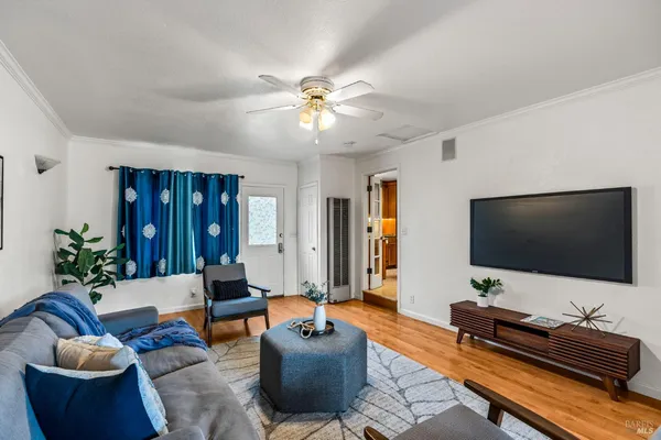 a living room with furniture and a flat screen tv