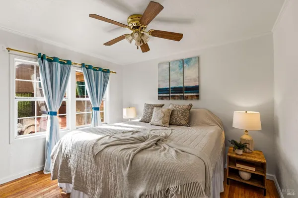 a bedroom with a bed furniture and a window