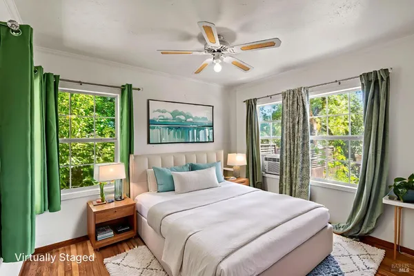 a bedroom with a large bed and a window