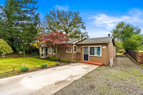 front view of a house with a yard