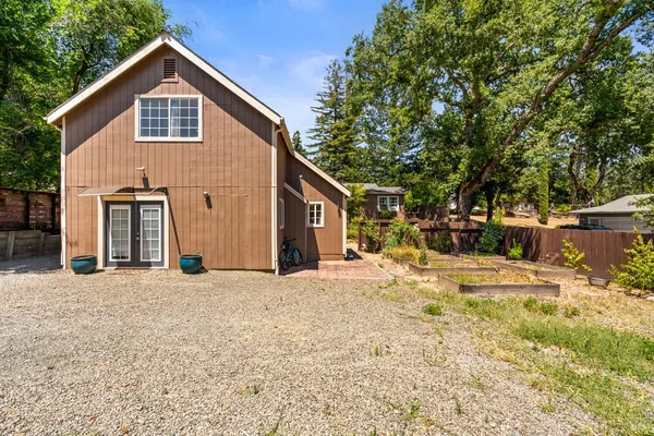 a view of a house with a yard and garage