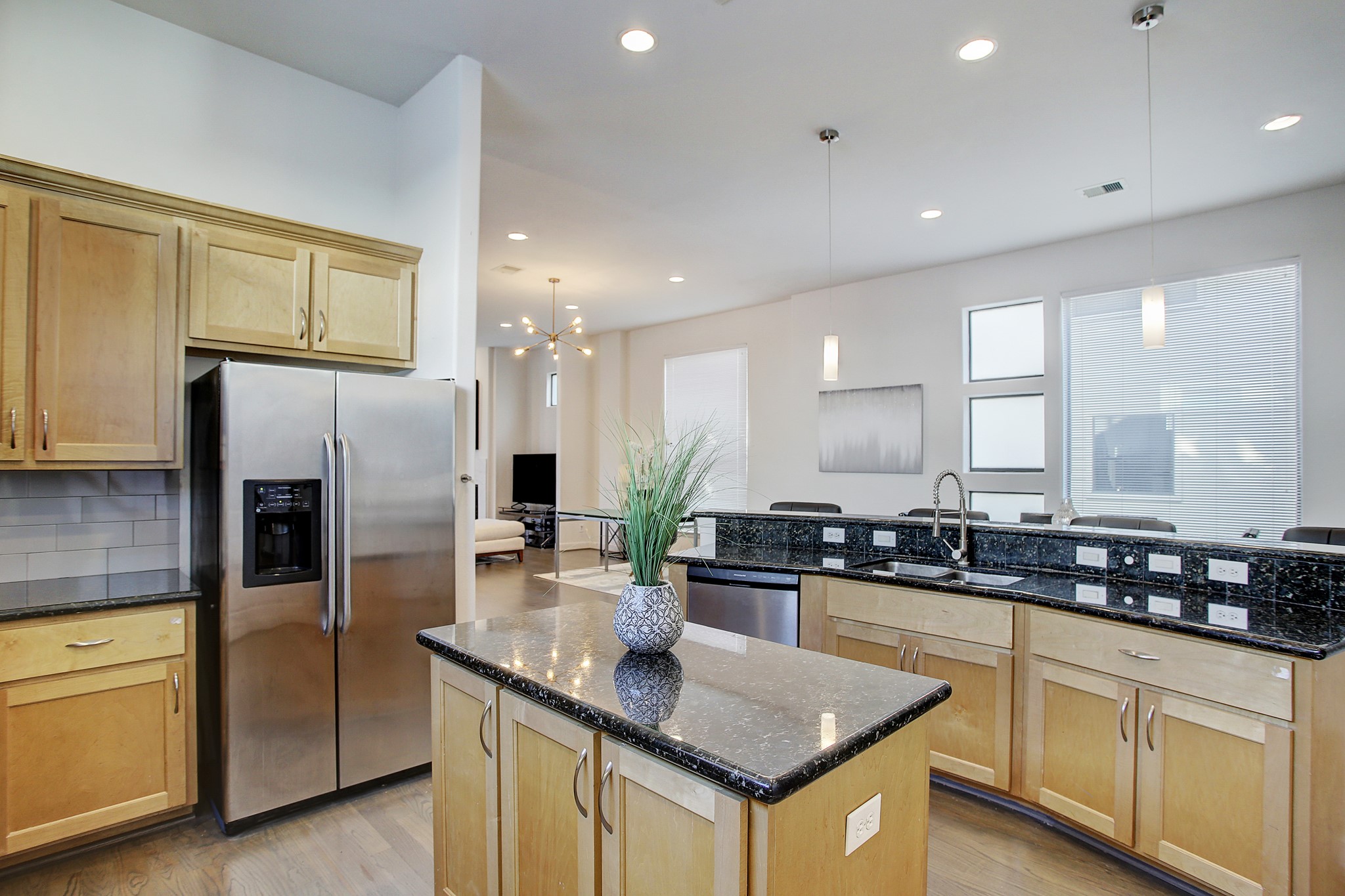 902 Roy Street Houston, TX 77007 - Photo 11 of 47 a kitchen with granite countertop a sink a counter top stainless steel appliances and cabinets