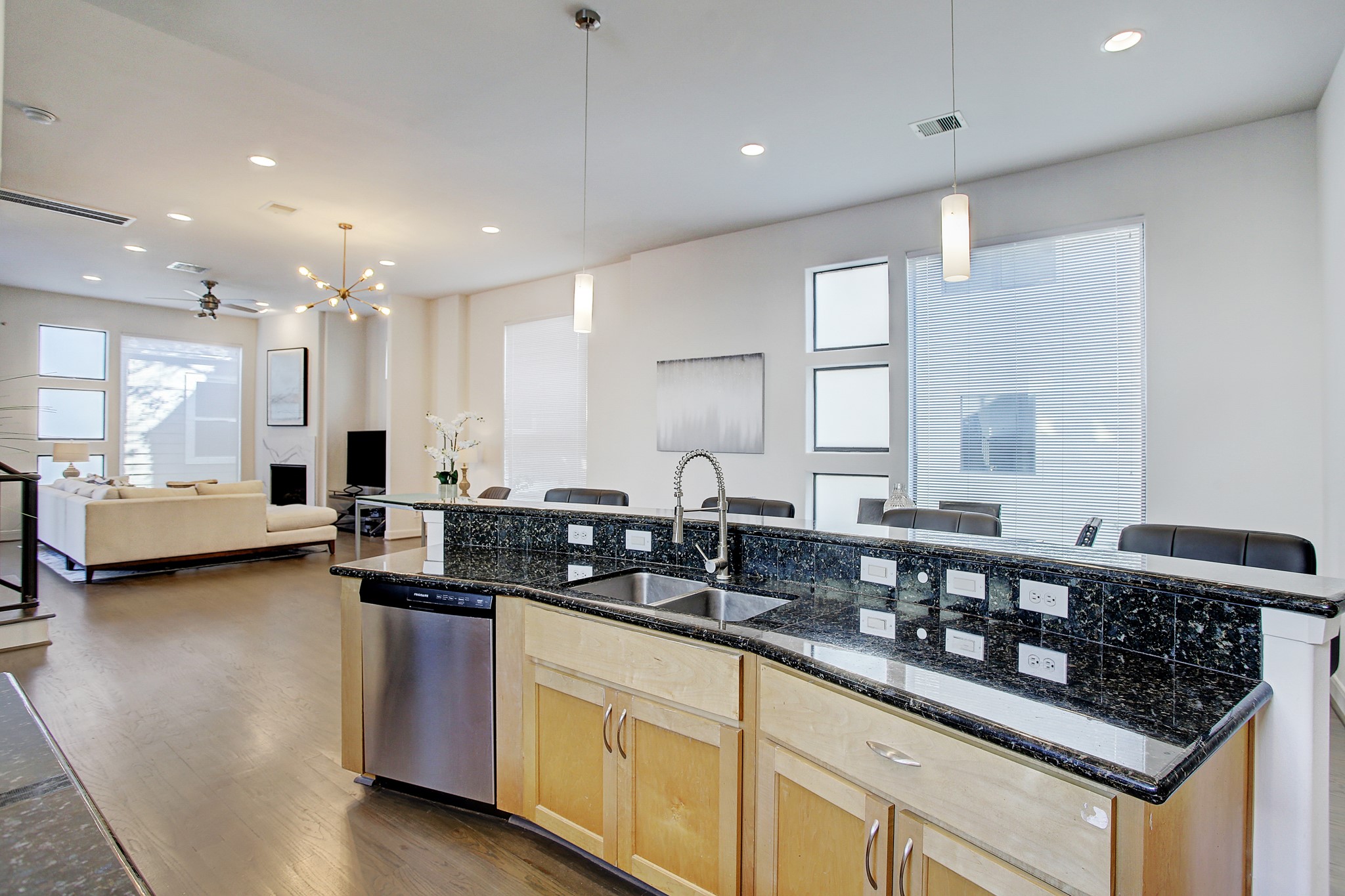 902 Roy Street Houston, TX 77007 - Photo 12 of 47 view of a kitchen with stainless steel appliances granite countertop a sink a stove a counter space and cabinets