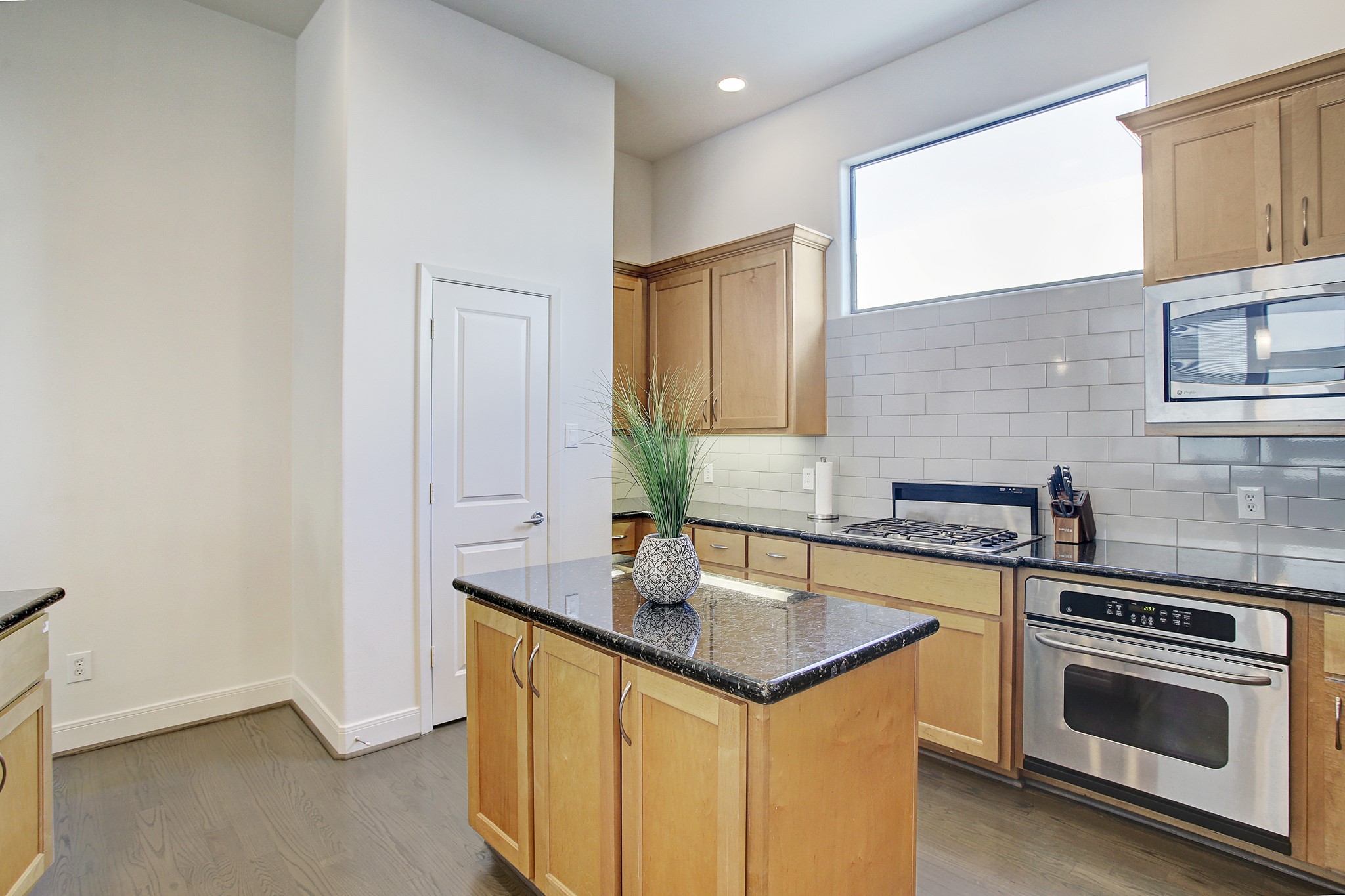 902 Roy Street Houston, TX 77007 - Photo 13 of 47 a kitchen with stainless steel appliances granite countertop a sink and a stove