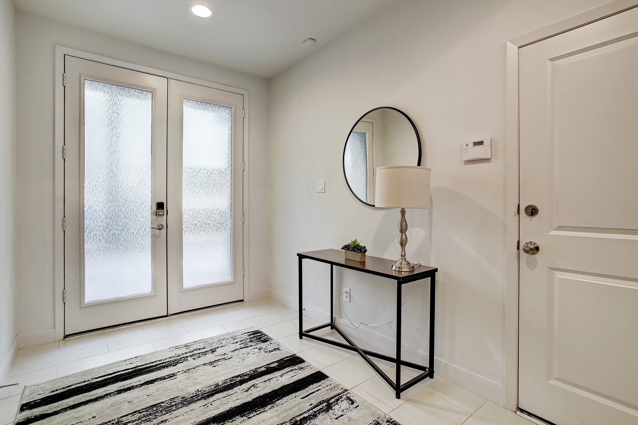 902 Roy Street Houston, TX 77007 - Photo 15 of 47 a front view of a house with wooden floor windows and a wooden door