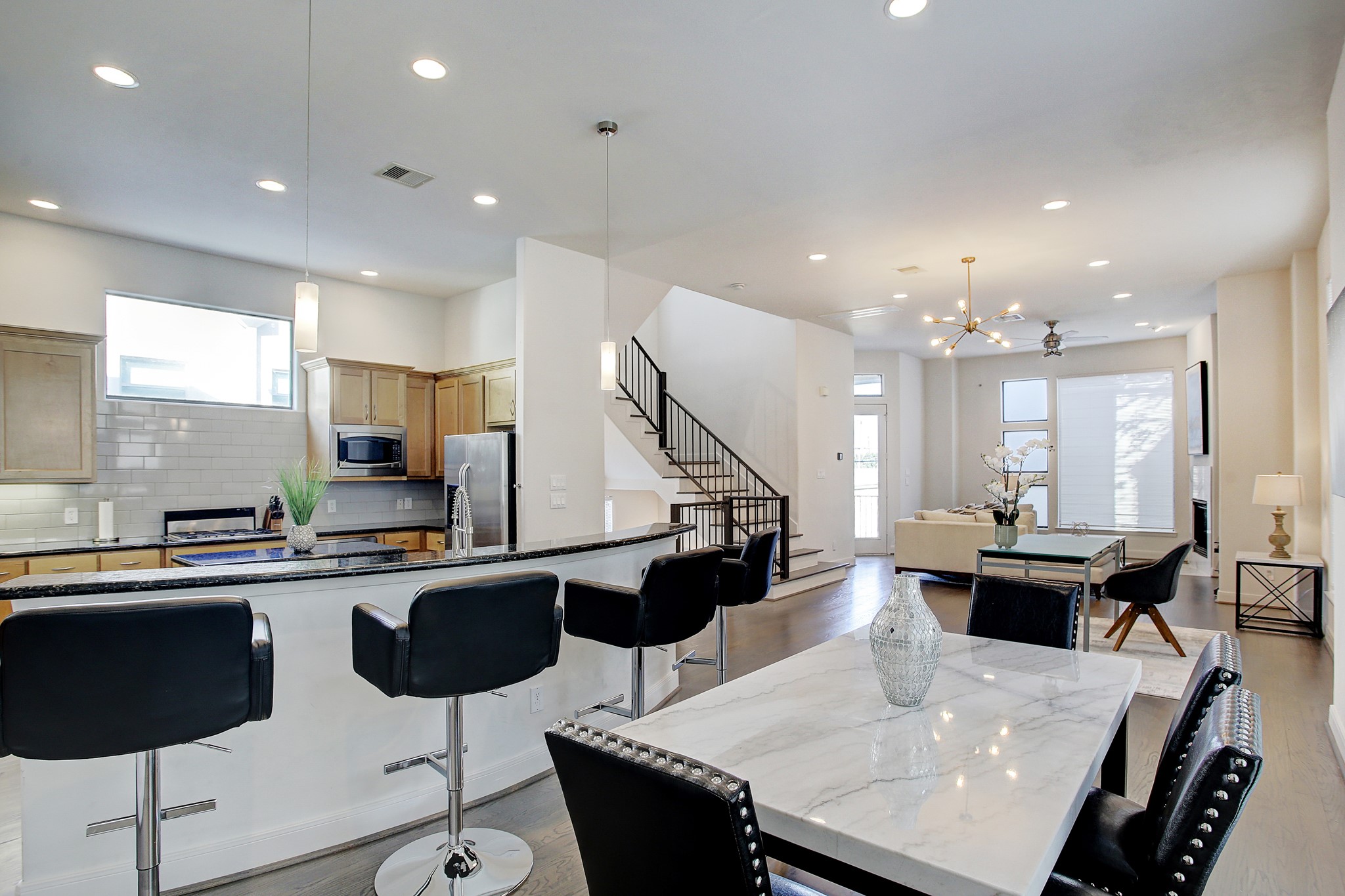 902 Roy Street Houston, TX 77007 - Photo 2 of 47 a kitchen with stainless steel appliances kitchen island granite countertop a sink and a stove