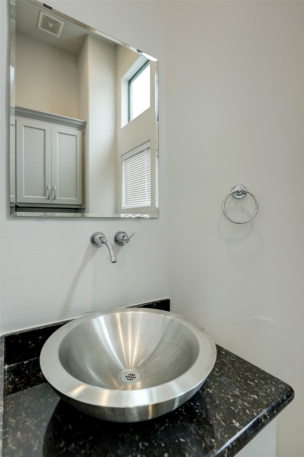 902 Roy Street Houston, TX 77007 - Photo 21 of 47 a bathroom with a sink and mirror