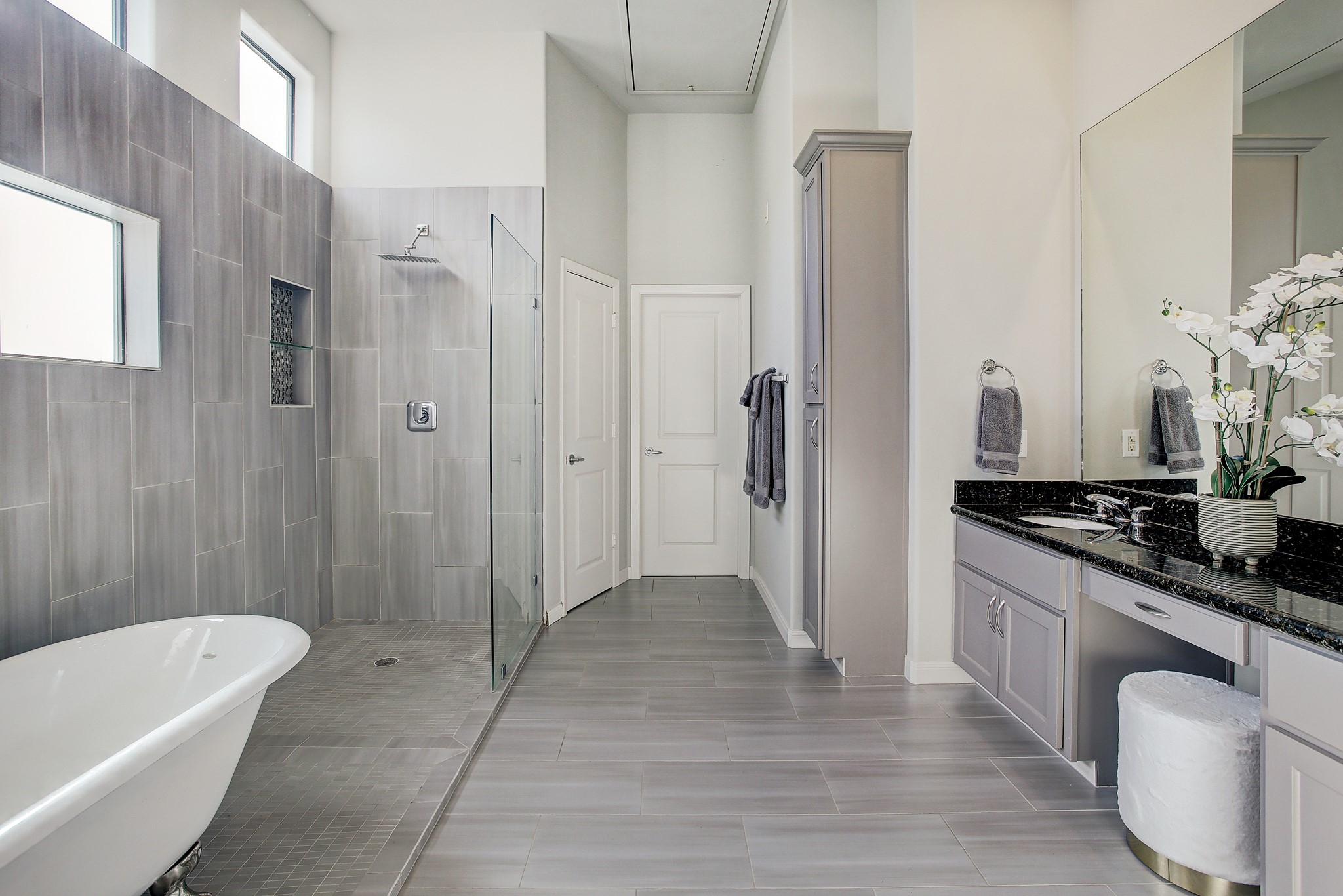 902 Roy Street Houston, TX 77007 - Photo 26 of 47 a bathroom with a granite countertop sink a toilet a mirror and shower