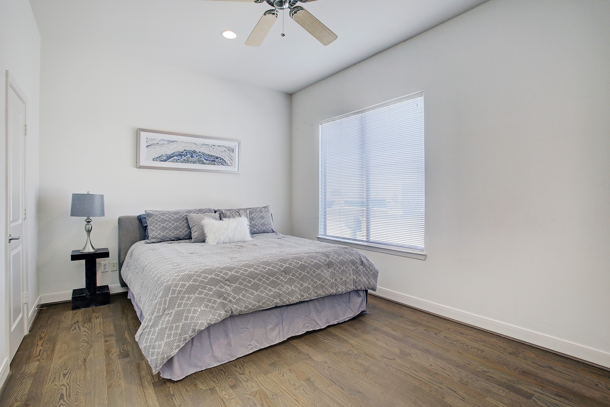 902 Roy Street Houston, TX 77007 - Photo 30 of 47 a bedroom with a bed and a night stand