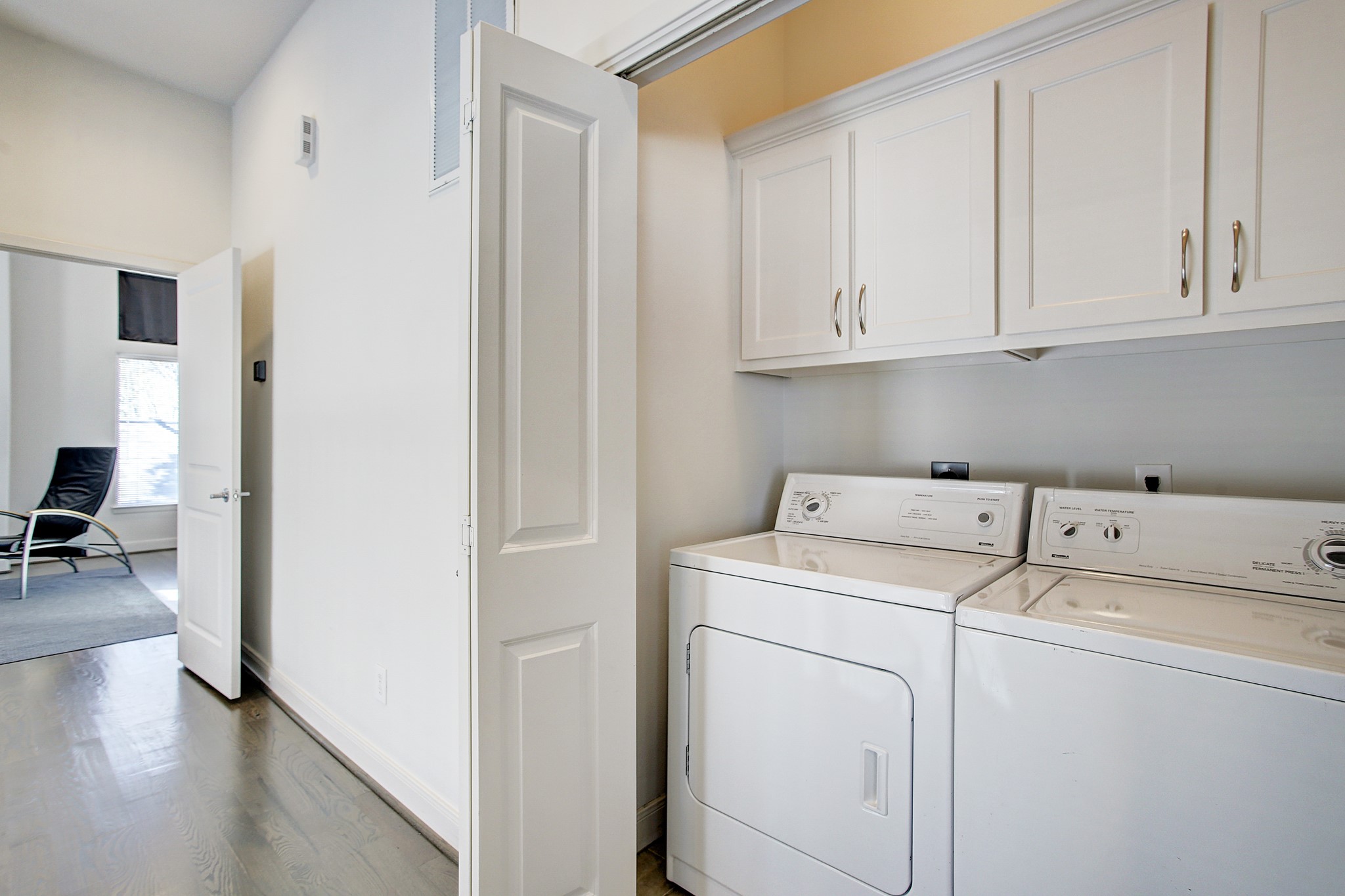 902 Roy Street Houston, TX 77007 - Photo 32 of 47 a view of storage and utility room with washer and dryer