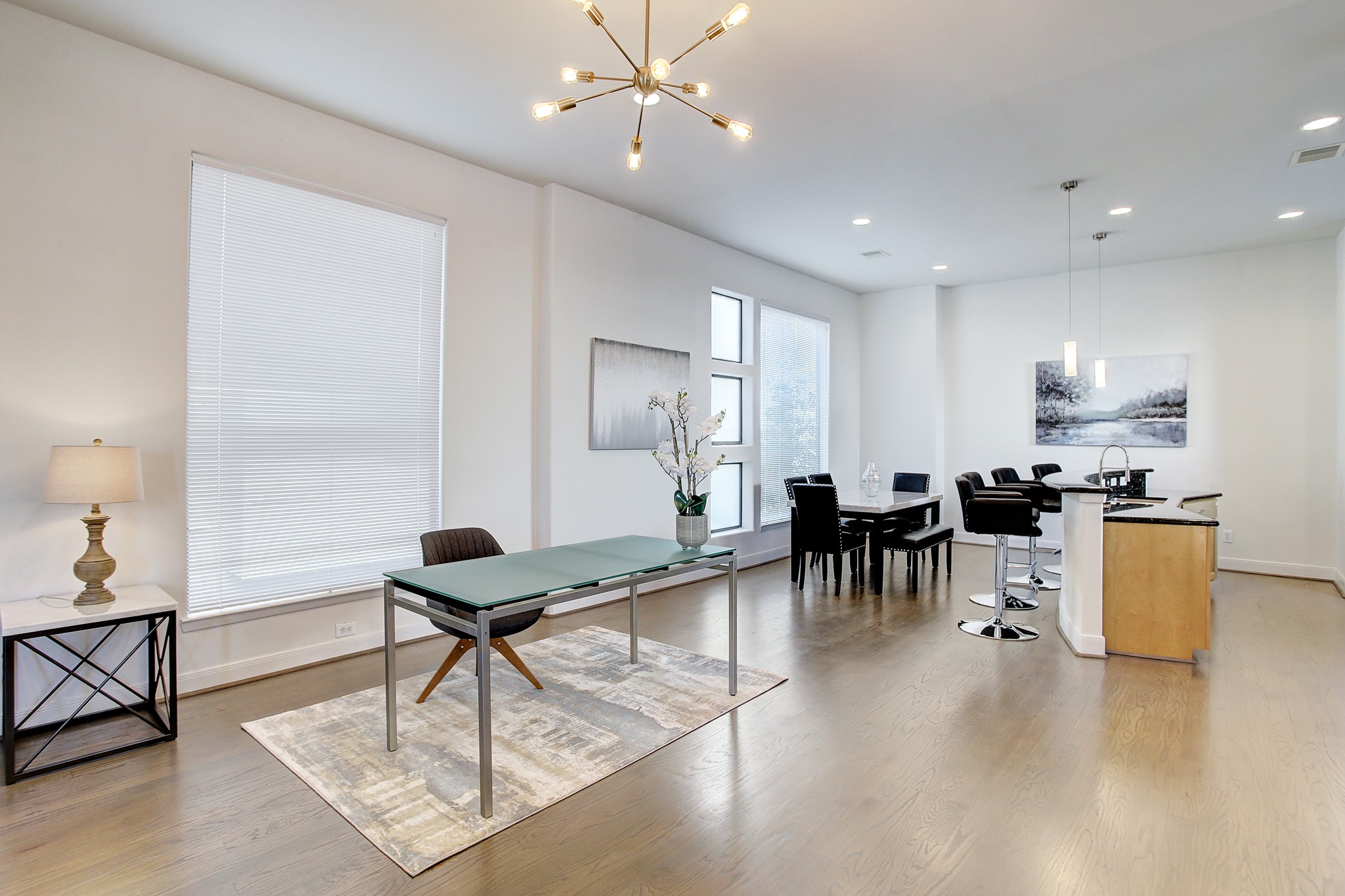 902 Roy Street Houston, TX 77007 - Photo 5 of 47 a living room with furniture a dining table and kitchen view