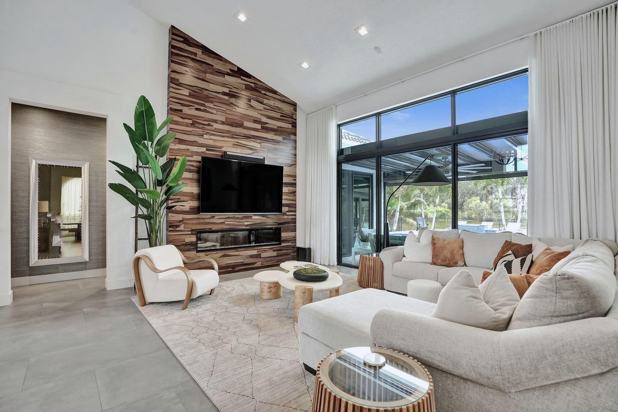 3222 Ridge Trace Davie, FL 33328 - Photo 12 of 77 a living room with furniture flat screen tv and a large window