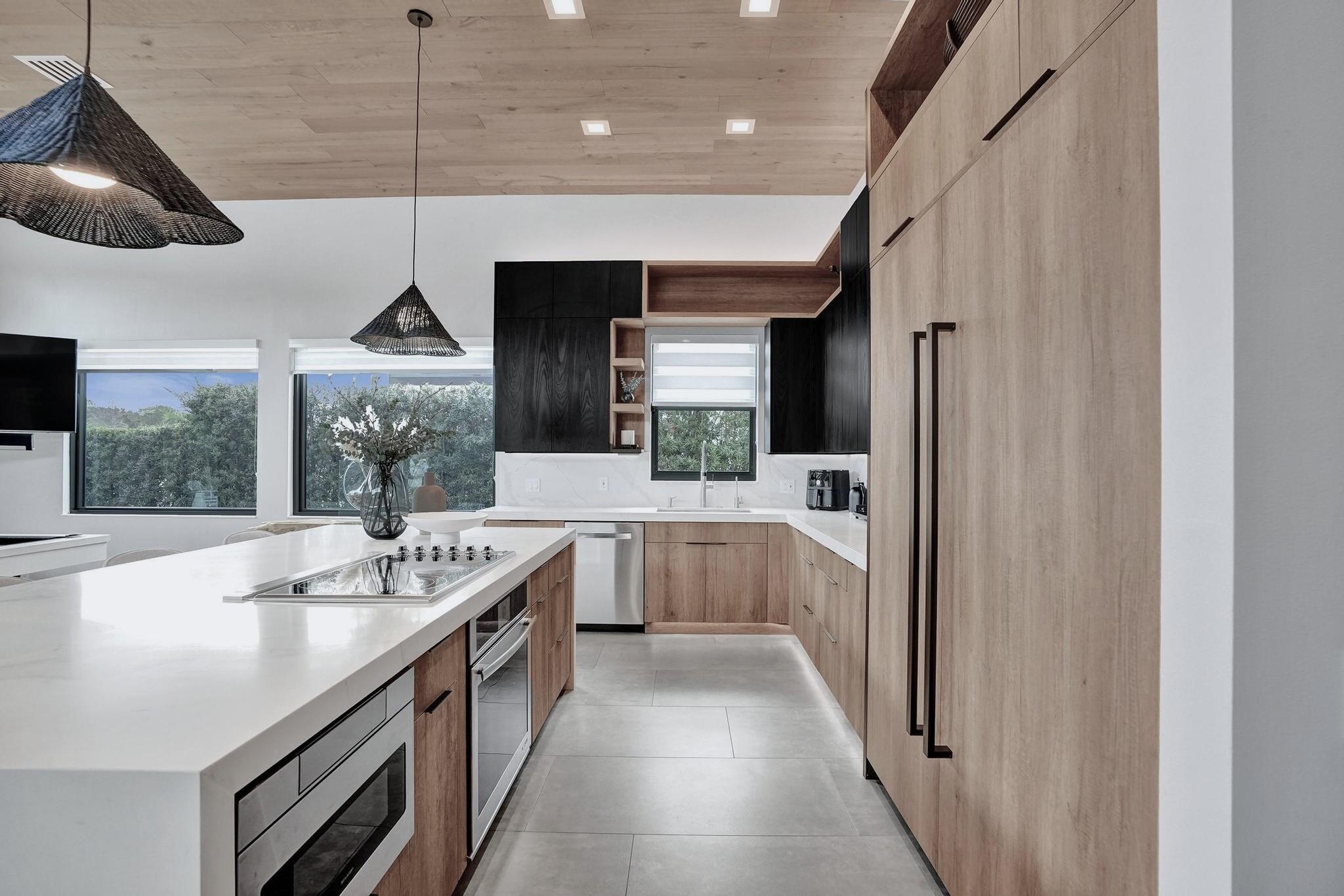 3222 Ridge Trace Davie, FL 33328 - Photo 18 of 77 a kitchen with stainless steel appliances granite countertop a sink a stove and a refrigerator