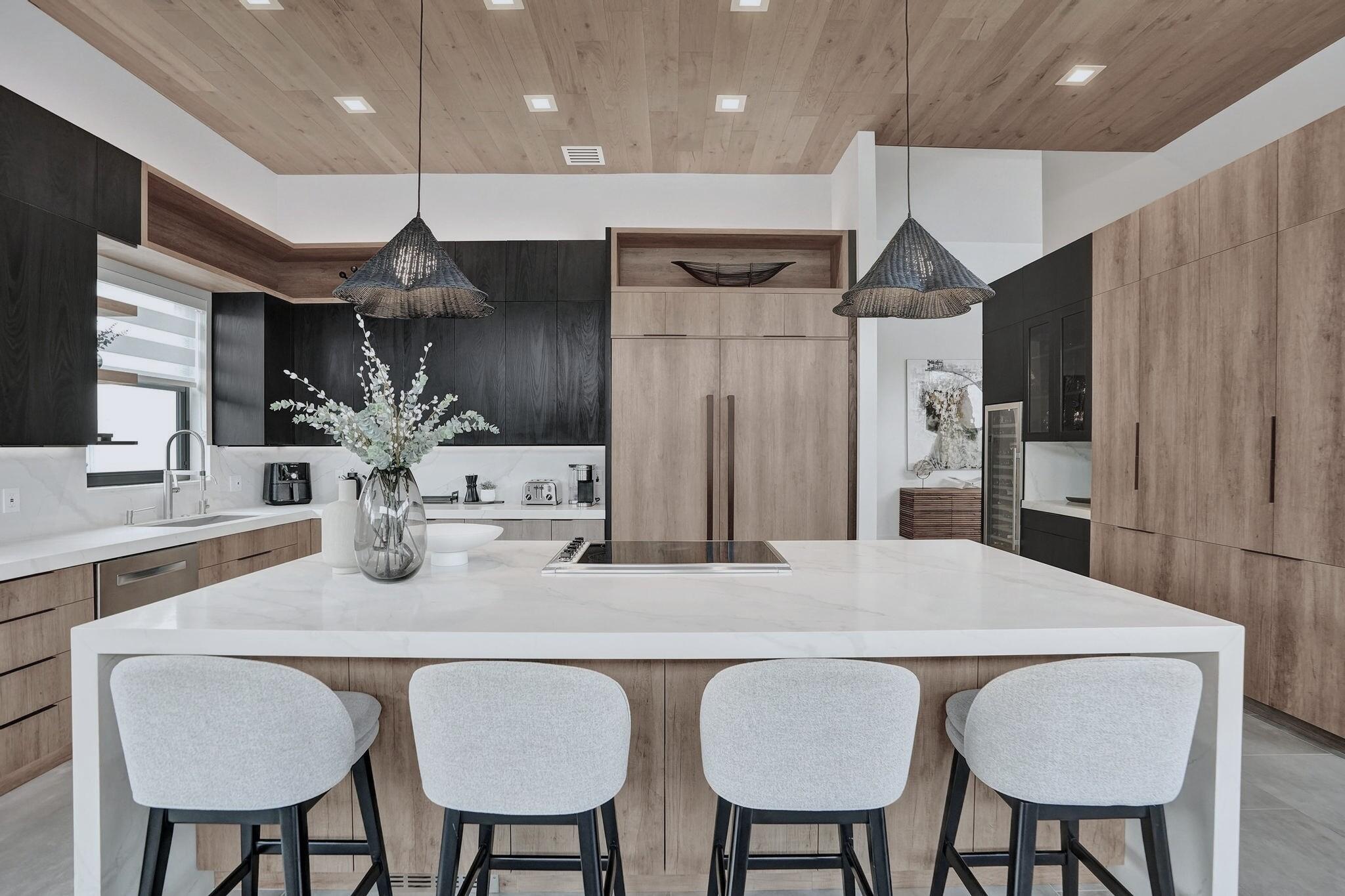 3222 Ridge Trace Davie, FL 33328 - Photo 22 of 77 a kitchen with stainless steel appliances kitchen island granite countertop a kitchen island and chairs in it