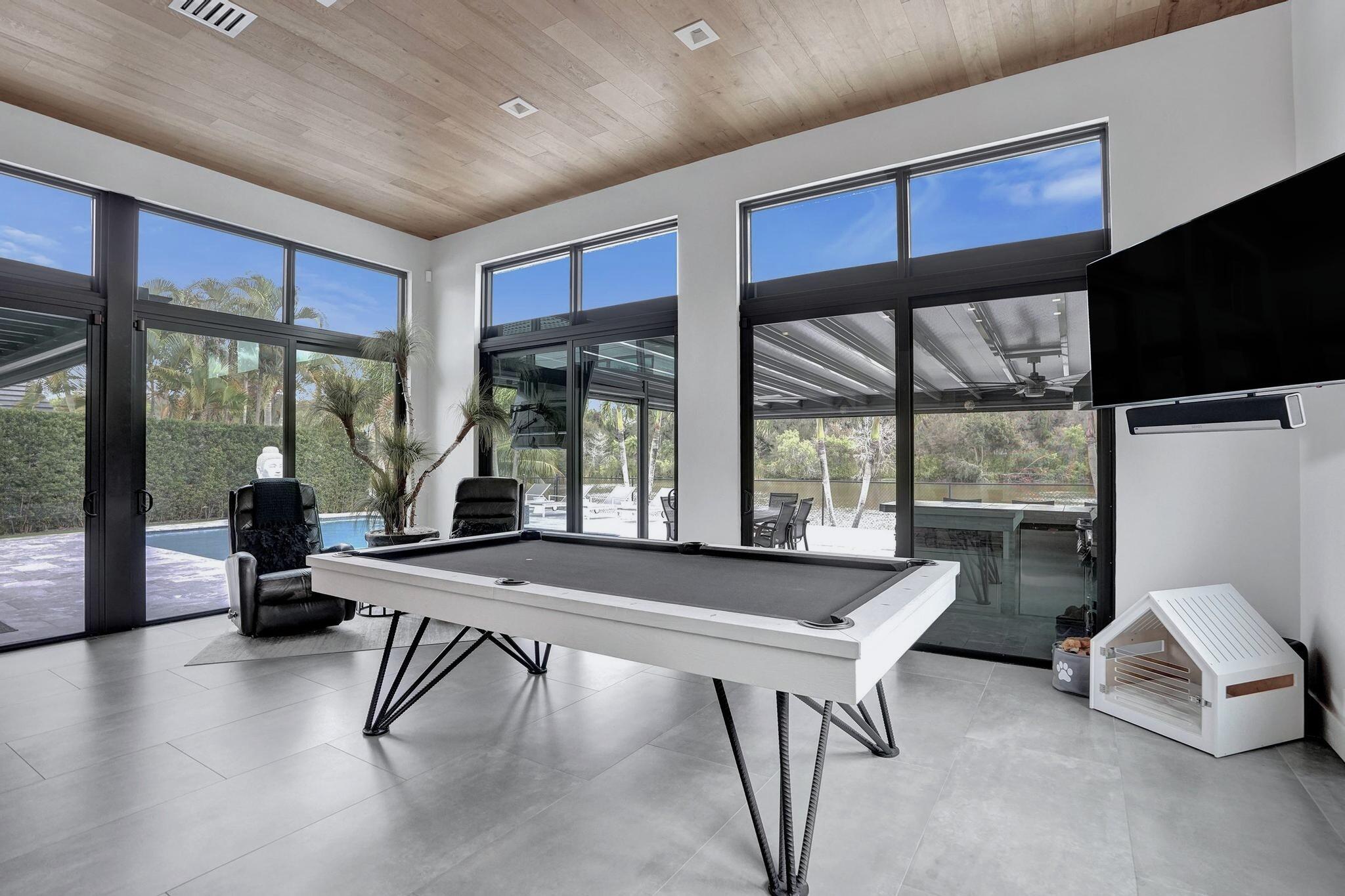 3222 Ridge Trace Davie, FL 33328 - Photo 25 of 77 a room with furniture and large windows