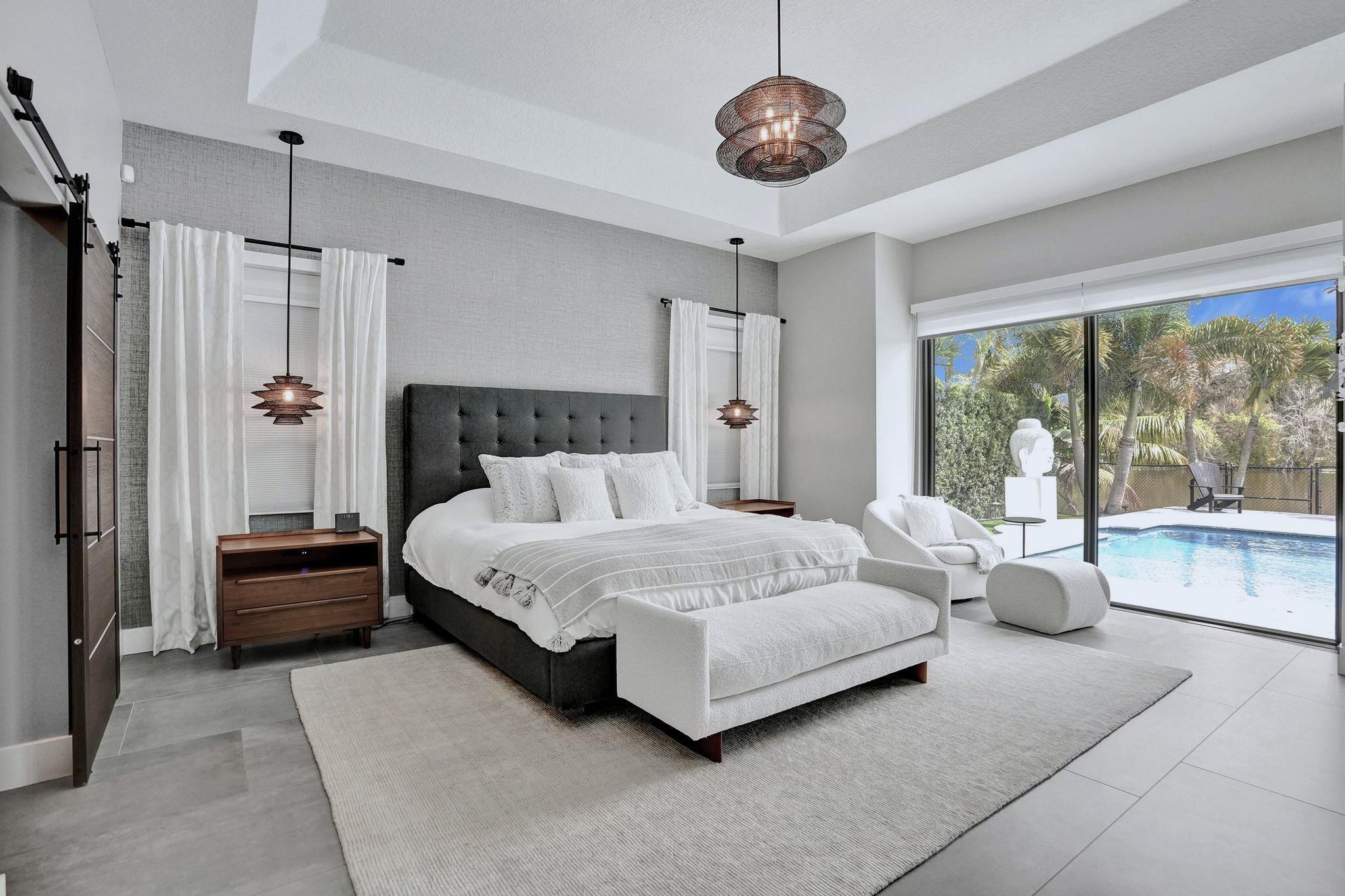 3222 Ridge Trace Davie, FL 33328 - Photo 29 of 77 a spacious bedroom with a bed and a large window