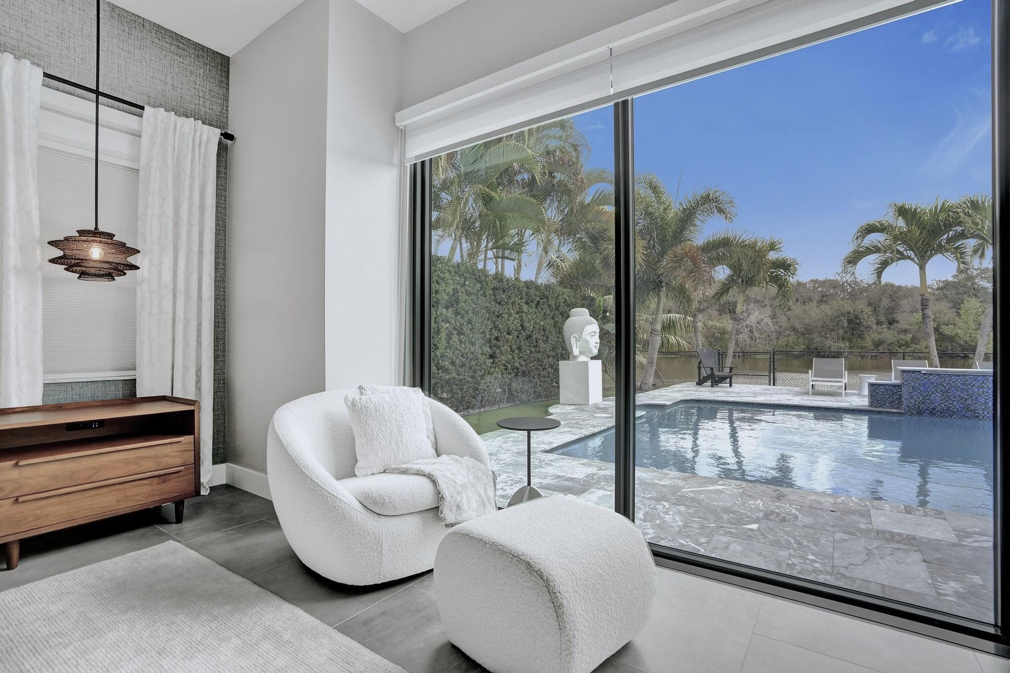 3222 Ridge Trace Davie, FL 33328 - Photo 38 of 77 a living room with furniture and a floor to ceiling window